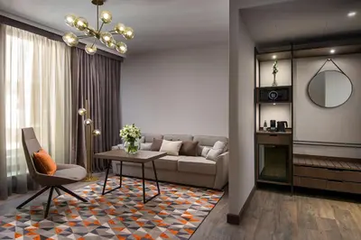 a living room with a couch and a table at Hyatt Regency Sofia in Sofia