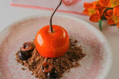 a red cherry on top of a bowl of chocolate at Hyatt Regency Sofia in Sofia