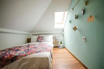 a bedroom with a bed and a window at Off Vitosha Blvd Designer Apart in Sofia
