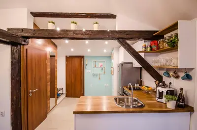 a kitchen with a wooden counter top and a sink at Off Vitosha Blvd Designer Apart in Sofia