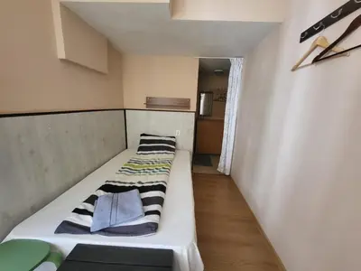 a small room with a bed in a room at East Gate Guest Rooms in Plovdiv