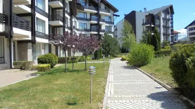 a sidewalk in front of some apartment buildings at ASPEN GOLF RESORT Ski & Spa RELAX APARTMENT in Bansko