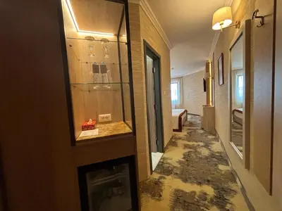 a hallway with a glass case in a room at Hissar Spa Hotel in Hisarya