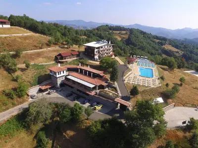 an aerial view of a mansion with a swimming pool at Panorama Family Hotel in Zlatograd