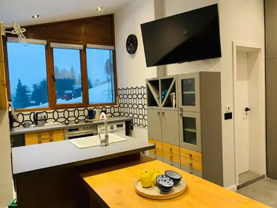 a kitchen with a sink and a counter top at Silver Box Pamporovo in Pamporovo