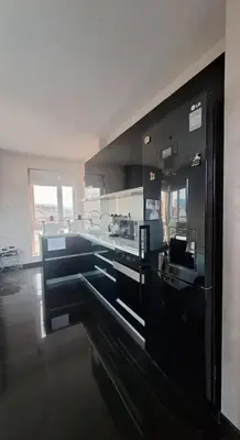 a kitchen with black counters and a counter top at AHINORA in Plovdiv