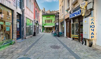 a cobblestone street in a city with buildings at The Perfect One-Bedroom Maisonette in Plovdiv by Flat Mаnager in Plovdiv