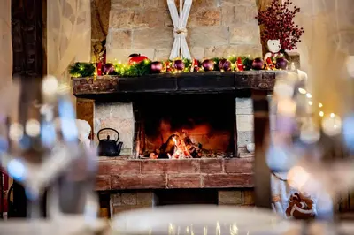 a fireplace with fruits and vegetables on top of it at TWO BEDROOM Apartment in Bansko