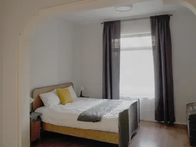 a bedroom with a bed and a large window at Caché - Bright One-Bedroom Apartment in Sofia by Flat Mаnager in Sofia