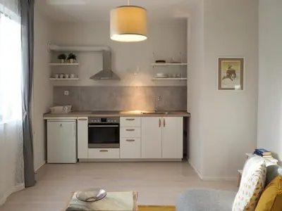 a kitchen with white cabinets and a sink at Caché - Bright One-Bedroom Apartment in Sofia by Flat Mаnager in Sofia