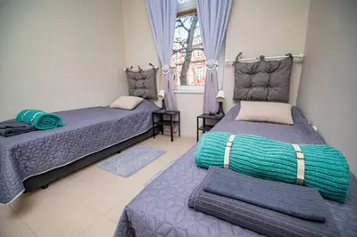 a bedroom with two beds and a window at Huge Stylish Apartment Monroe 1 / City Centre in Plovdiv