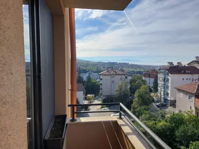 a balcony with a view of a city at Apartament Emi in Sandanski