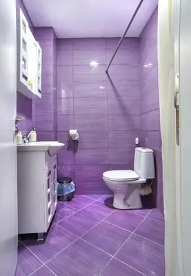 a purple bathroom with a toilet and a sink at Ancient Serdica 2BDR Family Friendly City Retreat in Sofia