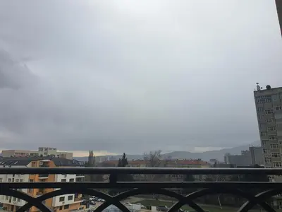 a view of a city with a bridge and buildings at VIP apartment & parking in Sofia