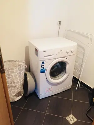 a washer and dryer sitting on the floor in a room at Fantastic Studio Studentski Grad in Sofia