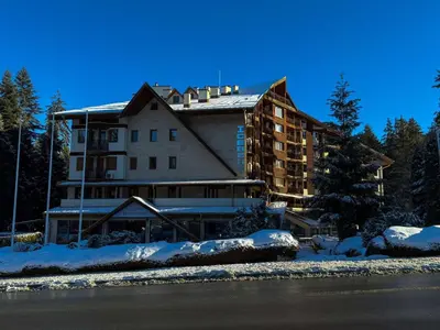 a large building with snow on the ground at Hotel Iceberg Borovets in Borovets