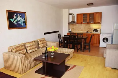 a living room with a couch and a table at Aparthotel Forest Nook in Pamporovo
