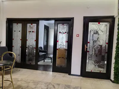 a group of doors with stained glass at TOP CENTER spacious apartment with free parking in Sofia