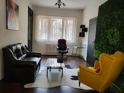 a living room with a couch and two chairs at TOP CENTER spacious apartment with free parking in Sofia