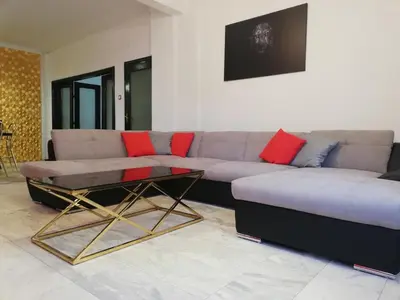 a living room with a couch and a coffee table at TOP CENTER spacious apartment with free parking in Sofia