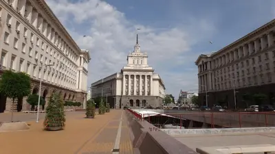 a large white building with a steeple in a city at Beautiful Jewel in Top Center in Sofia
