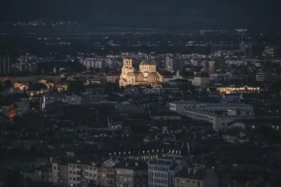 a view of a city at night at Beautiful Jewel in Top Center in Sofia