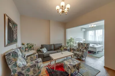 a living room with a couch and a table at Beautiful Jewel in Top Center in Sofia