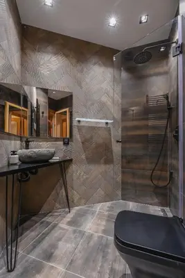 a bathroom with a shower with a toilet and a desk at Sofia Dream Apartment - The Library - 3-BDR, 2-BTHR by Flat Mаnager in Sofia