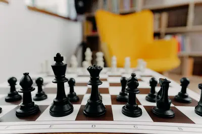 a chess board with black chess pieces on it at Magnificent apartment in the mountains in Banite