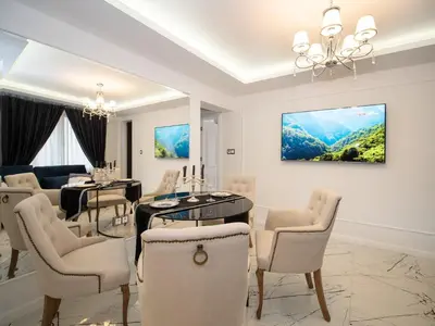 a dining room with a table and chairs at Paradise Center Premium Suite 2 in Sofia