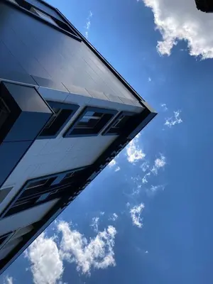 a close up of the corner of a building with the sky in the background at Hotel Shterev Karlovo in Karlovo