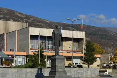 a statue of a man in front of a building at Hotel Shterev Sopot in Sopot