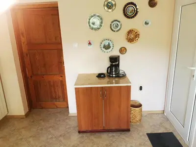 a kitchen with a coffee maker on top of a counter at Къщата на Румен in Sofia