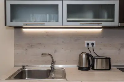 a kitchen counter with a sink and a microwave at Alma Apartment - Stylish 1BD Flat with Balcony by Flat Mаnager in Plovdiv