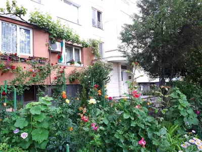a garden of flowers in front of a building at 2 Bedrooms with private Bath and balcony near the Airport in Sofia