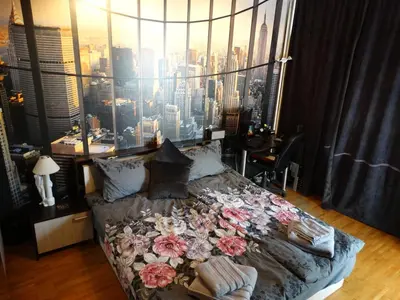 a bedroom with a bed with a view of a city at 2 Bedrooms with private Bath and balcony near the Airport in Sofia