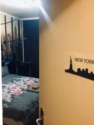 a bedroom with a new york sign on the wall at 2 Bedrooms with private Bath and balcony near the Airport in Sofia