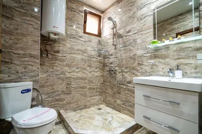 a bathroom with a toilet and a sink and a shower at Park Apartment Emilin in Sandanski