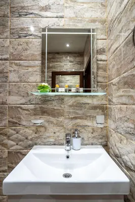 a bathroom with a sink and a mirror at Park Apartment Emilin in Sandanski
