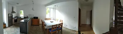 a kitchen with a table and chairs in a room at VILLA IRINA - Govedartsi in Govedartsi