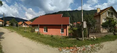 a house sitting on the side of a dirt road at VILLA IRINA - Govedartsi in Govedartsi