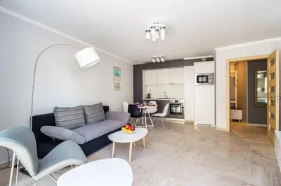 a living room with a couch and a table at Elegance, City center, Kapana in Plovdiv