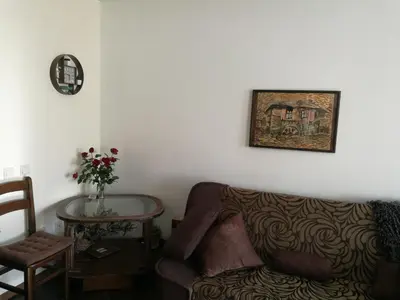 a living room with a couch and a table at Studio Anastasia in Sapareva Banya