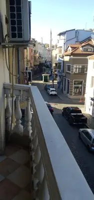 a balcony with a view of a street with cars at ПАИ Хост in Plovdiv