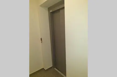 a door in a room with a door in the wall at Cosy Charming Apartment in Blagoevgrad