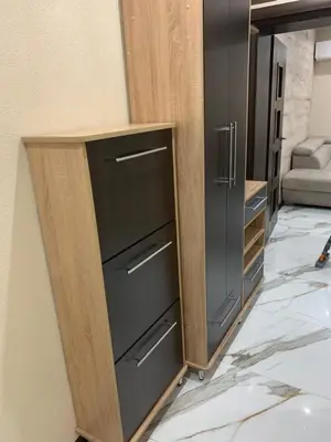 a cabinet with three drawers in a room at Патилови in Sandanski