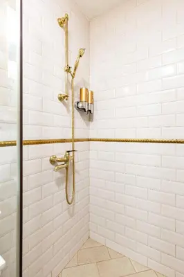 a bathroom with a shower with white tiles at Stylish 1BD Flat with a terrace near the centre of Plovdiv by Flat Mаnager in Plovdiv