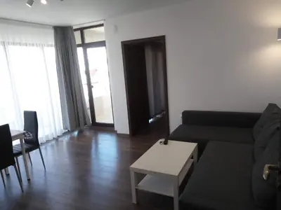 a living room with a couch and a table at Апартамент Перла in Sandanski