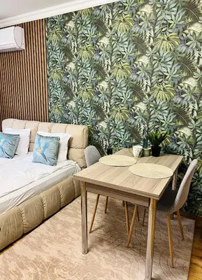 a living room with a couch and a table at Vega Apartment in Velingrad