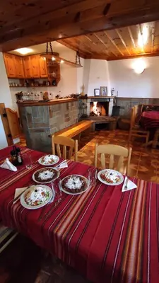 a table with plates of food on top of it at Къща за гости Каневи in Momchilovtsi